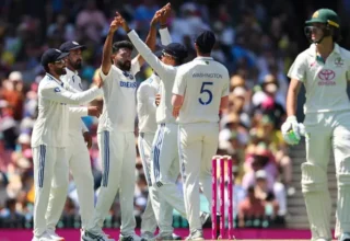 India's Jasprit Bumrah (C) celebrates the wicket of Australia's Usman Khawaja during day one of the fifth Test match between Australia and India at the Sydney Cricket Ground on January 3, 2025