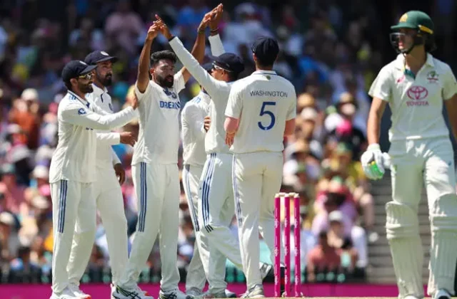 India's Jasprit Bumrah (C) celebrates the wicket of Australia's Usman Khawaja during day one of the fifth Test match between Australia and India at the Sydney Cricket Ground on January 3, 2025